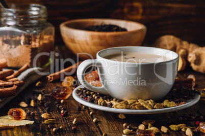 Masala Chai in White Cup with Different Spices