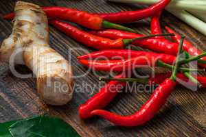 Mini chili peppers with galangal root and leaf of kaffir lime