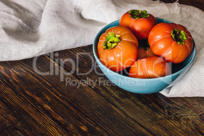 Persimmons in Blue Bowl