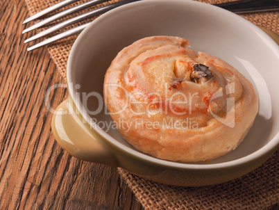 Tasty raisin snail with icing sugar