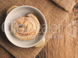 Tasty raisin snail with icing sugar