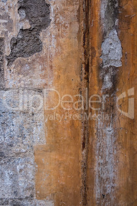 Vertical image of worn concrete wall.