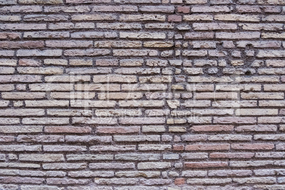 Rotten brick wall background texture.