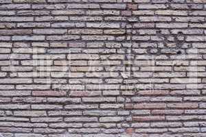 Rotten brick wall background texture.