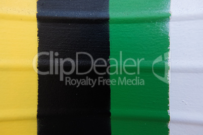 Metallic rolling shutter painted in yellow, black, green and whi