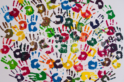 Wallpaper of colorful handprints on a wall.