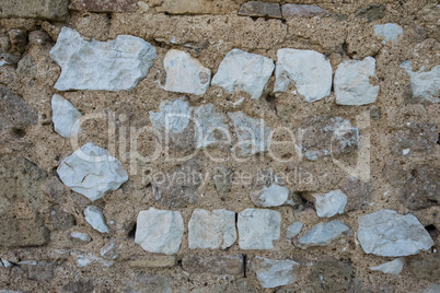 Detail view of white square stone brick wall.