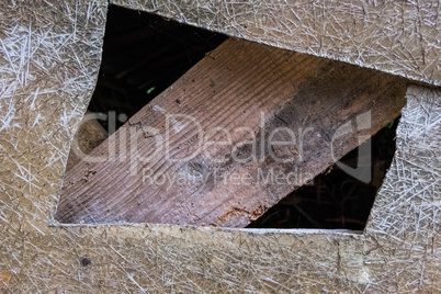 Wood plank on a fiberglass hole wall.