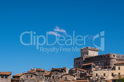 Landscape view of a medieval village with a castle with blue sky