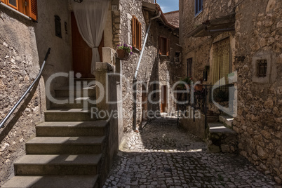 Sun light design on a medieval town alley.