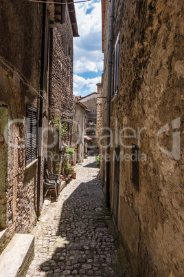 Ancient worn walls of a medieval town alley.