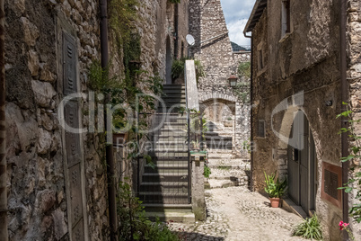 Metallic modern gate of a residence on a medieval town.