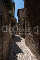 Alley of a medieval town made of stone.