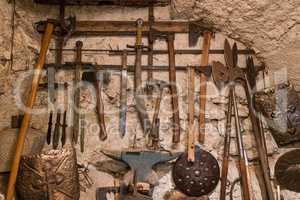 Medieval weapons on a stone wall. Cool background.