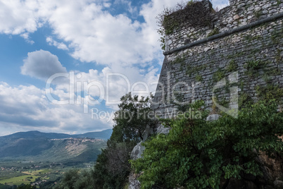 Medieval castle walls and landscape of nature in the background.