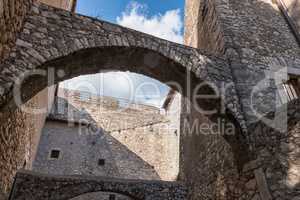 Low angle view of stone castle arches and walls from an inside c