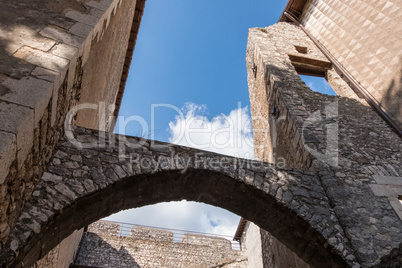 Low angle view of old castle arches and walls from an inside cou