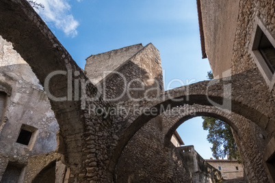 Low angle view of a medieval stone wall castle with blue sky bac