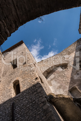 Vertical low angle view of a tower of medieval castle with blue