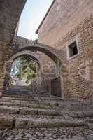 Low angle view of stairs and arches of medieval castle with whit
