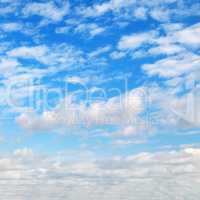 cumulus clouds in the blue sky.