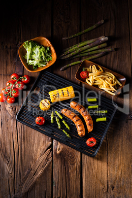 grilled krakauer with french fries and green salad