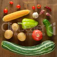 Vegetables laid out on a wooden table. Flat lay,top view.