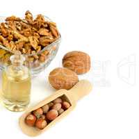 Oil of walnut and hazelnut, nut fruit isolated on white backgrou