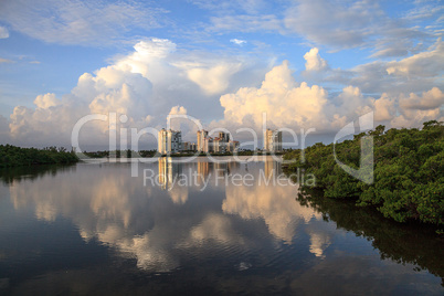Reflection of clouds in the water at Sunrise over the riverway o