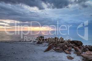 Rain pours from dark clouds over Clam Pass Beach in Naples, Flor