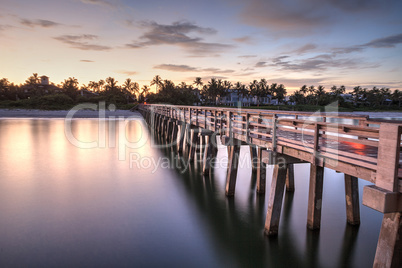 Early sunrise over the Naples Pier on the Gulf Coast of Naples,