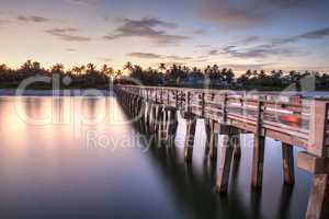 Early sunrise over the Naples Pier on the Gulf Coast of Naples,