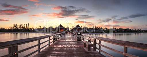 Early sunrise over the Naples Pier on the Gulf Coast of Naples,