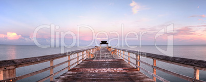 Early sunrise over the Naples Pier on the Gulf Coast of Naples,