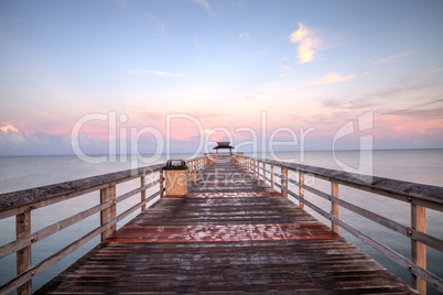 Early sunrise over the Naples Pier on the Gulf Coast of Naples,