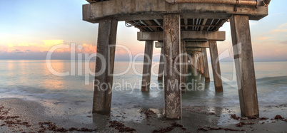 Early sunrise over the Naples Pier on the Gulf Coast of Naples,