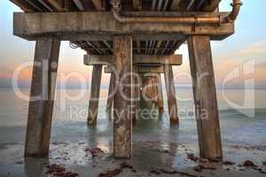 Early sunrise over the Naples Pier on the Gulf Coast of Naples,