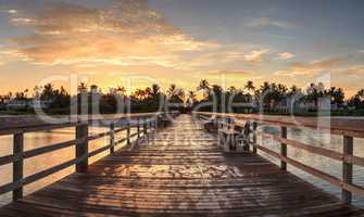 Early sunrise over the Naples Pier on the Gulf Coast of Naples,