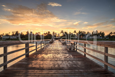 Early sunrise over the Naples Pier on the Gulf Coast of Naples,