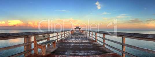 Early sunrise over the Naples Pier on the Gulf Coast of Naples,