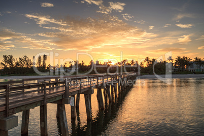 Early sunrise over the Naples Pier on the Gulf Coast of Naples,