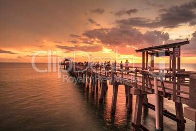 Pink and purple sunset over the Naples Pier on the Gulf Coast of