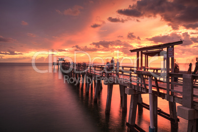 Pink and purple sunset over the Naples Pier on the Gulf Coast of