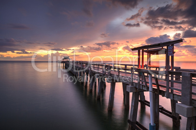 Pink and purple sunset over the Naples Pier on the Gulf Coast of