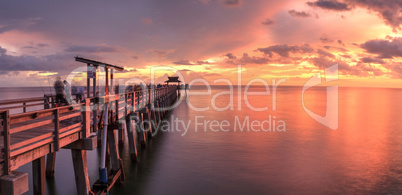 Pink and purple sunset over the Naples Pier on the Gulf Coast of