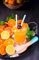 freshly squeezed orange juice with ice in glass