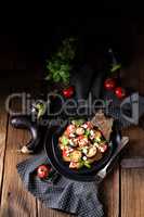 Eggplant grilled with aromatic feta cheese and tomatoes