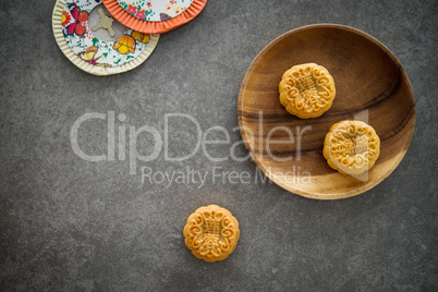 Mid-Autumn Festival Moon cakes with copy space on low light back