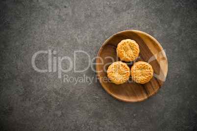 Mid-Autumn Festival Mooncakes with copy space on low light backg
