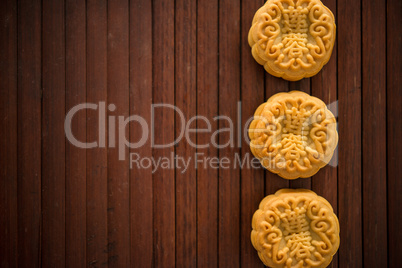 Moon cakes on bamboo mat dark light with copy space